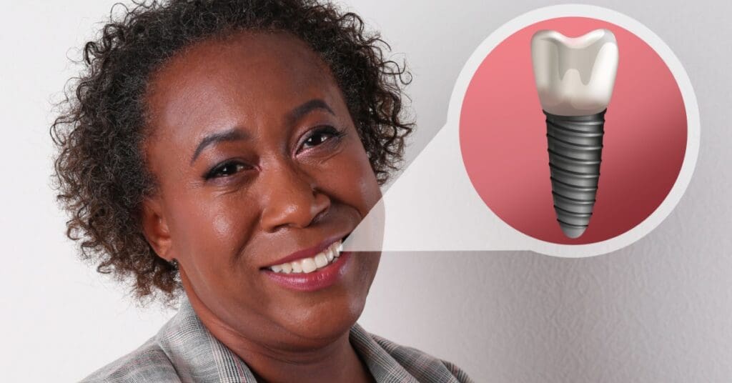 African American woman with dental implant image toward her mouth