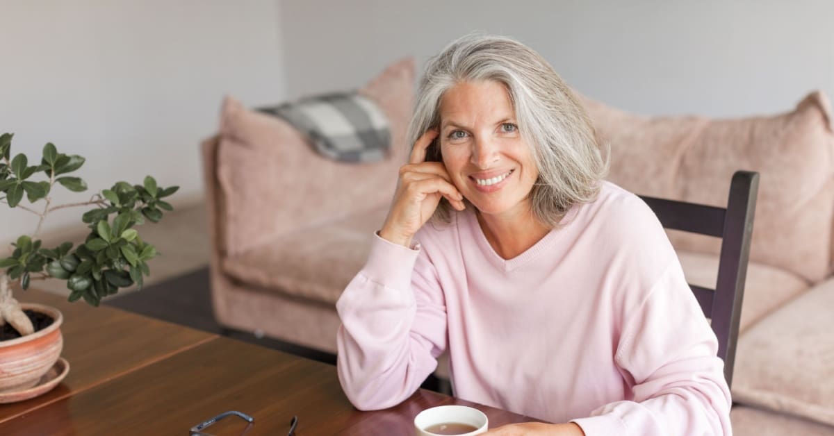 older woman smiling, concept of Dental Bridges To Replace Missing Teeth