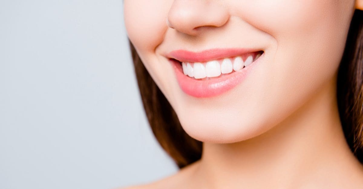 woman smiling, concept of Restorative Dentistry vs Cosmetic Dentistry