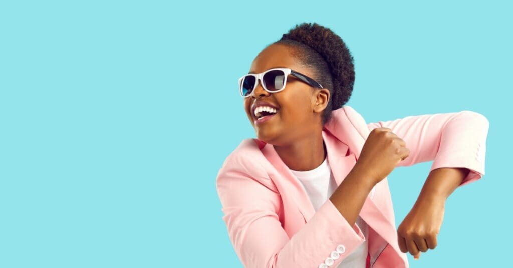 African american woman with glasses smiling, concept of oral hygiene and luxury fashion