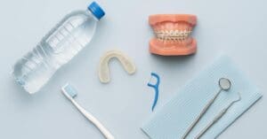 Teen Oral Health Tips showing water bottle, toothbrush, dental supplies